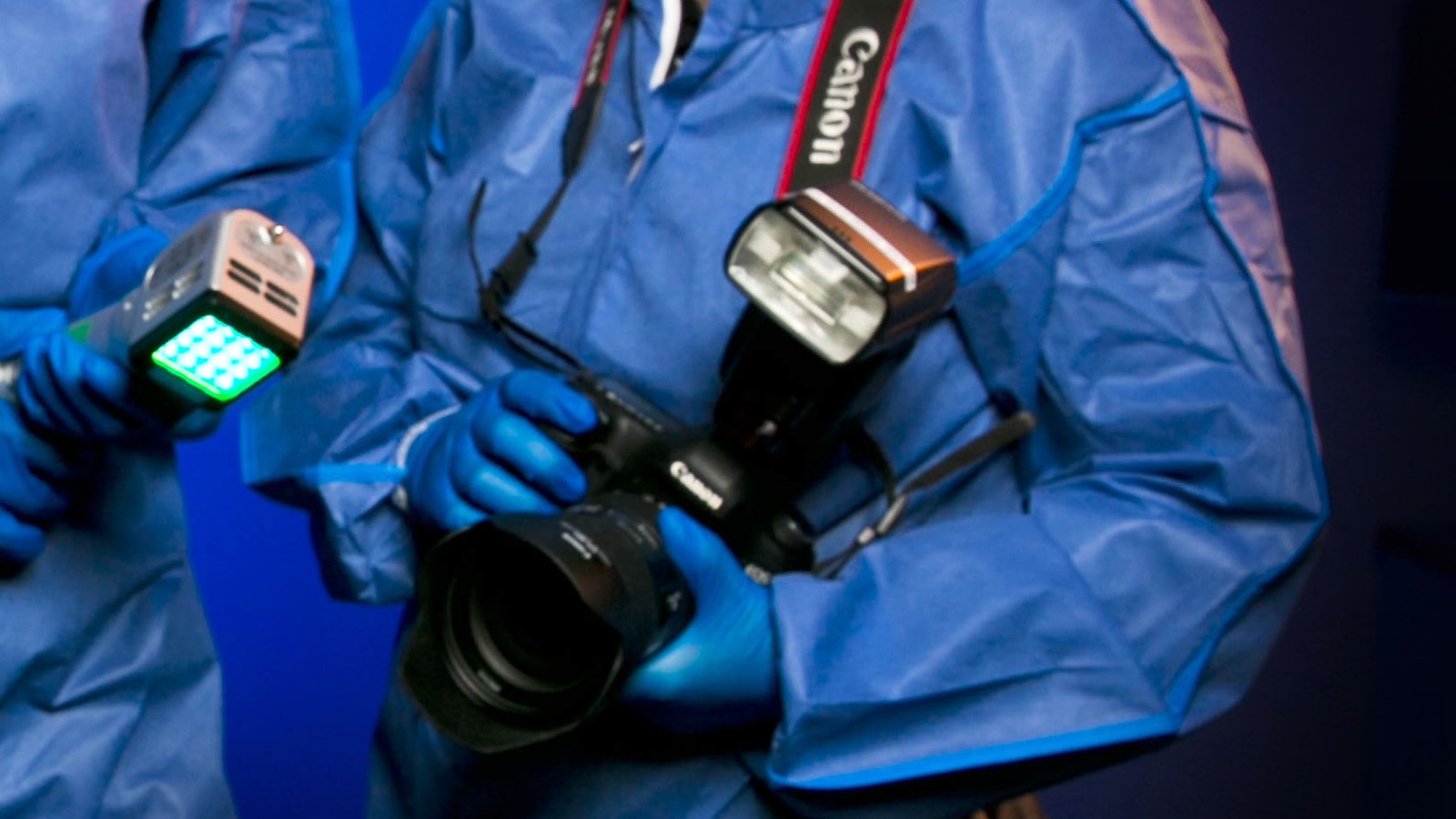 Forensic officer holding a camera