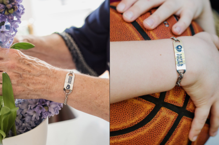 Two people wearing Safe & Found bracelets