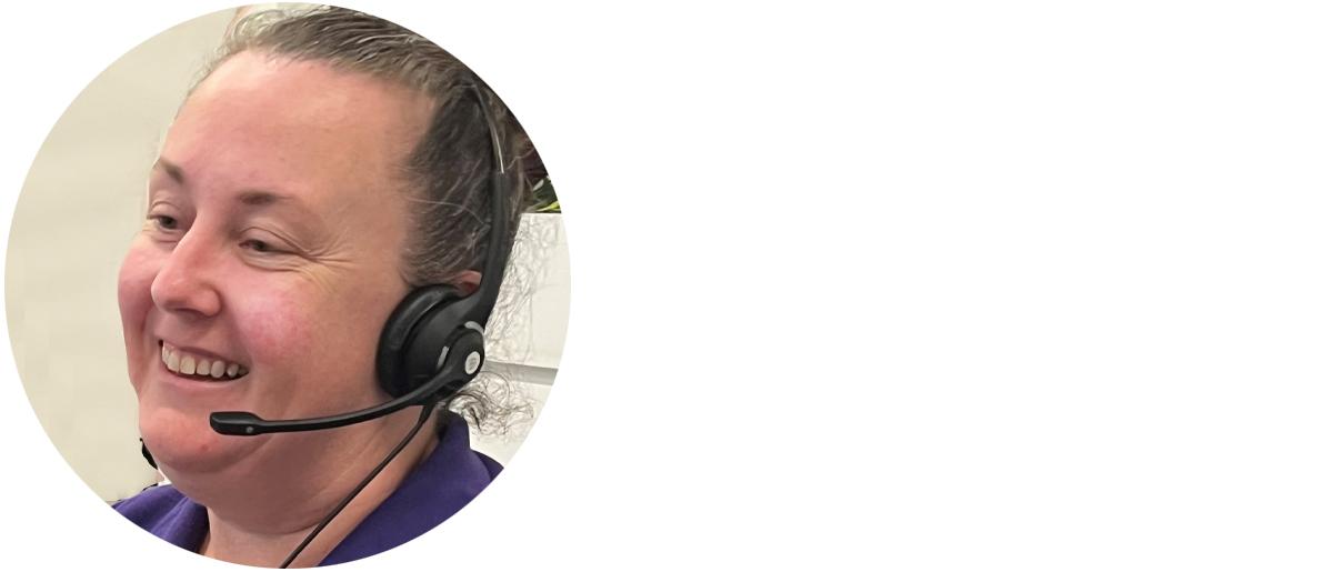 Smiling Client Services Officer wearing headphones