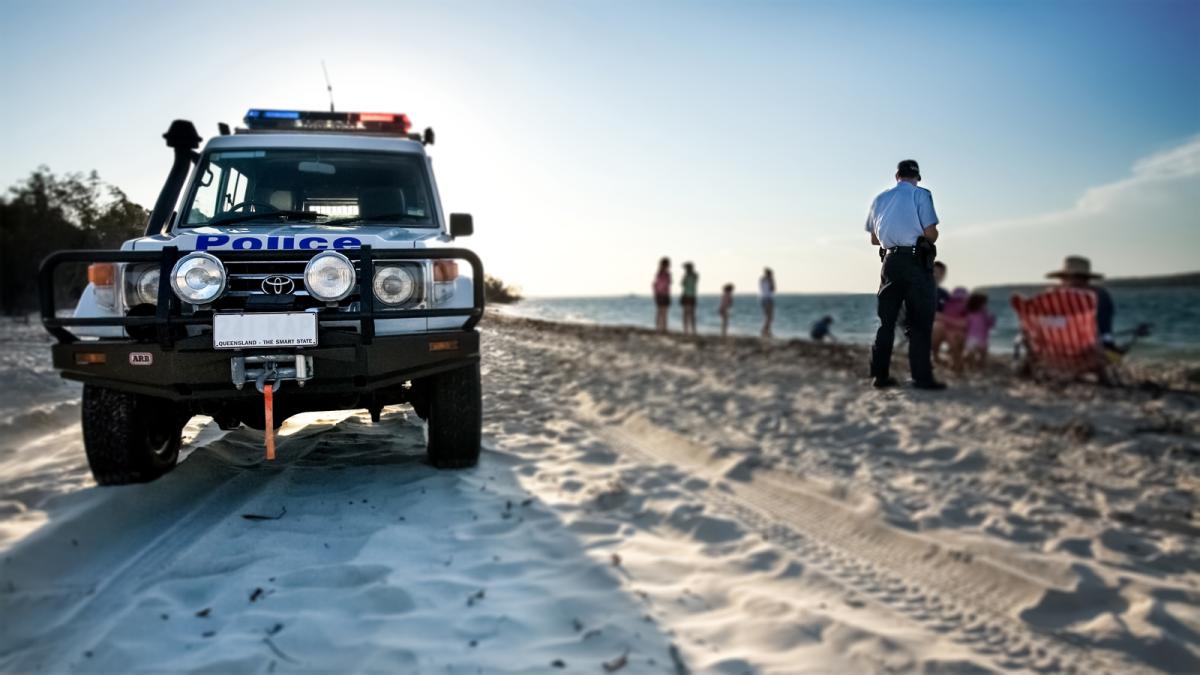 police vehicle on a beach